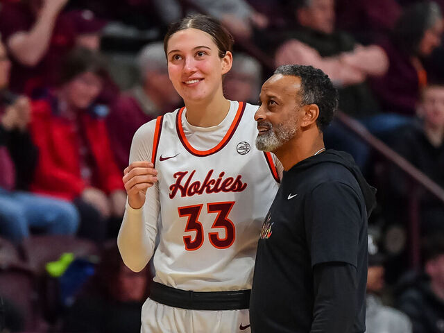 BLACKSBURG, VA - DECEMBER 10: Virginia Tech Hokies head coach Kenny Brooks and Virginia Tech Hokies center Elizabeth Kitley (33) during a time out during a college basketball game between the Radford Highlanders and the Virginia Tech Hokies on December 10, 2023 in Cassell Coliseum in Blacksburg, VA.