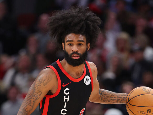 CHICAGO, ILLINOIS - DECEMBER 21: Coby White #0 of the Chicago Bulls dribbles up the court against the San Antonio Spurs during the second half at the United Center on December 21, 2023 in Chicago, Illinois.