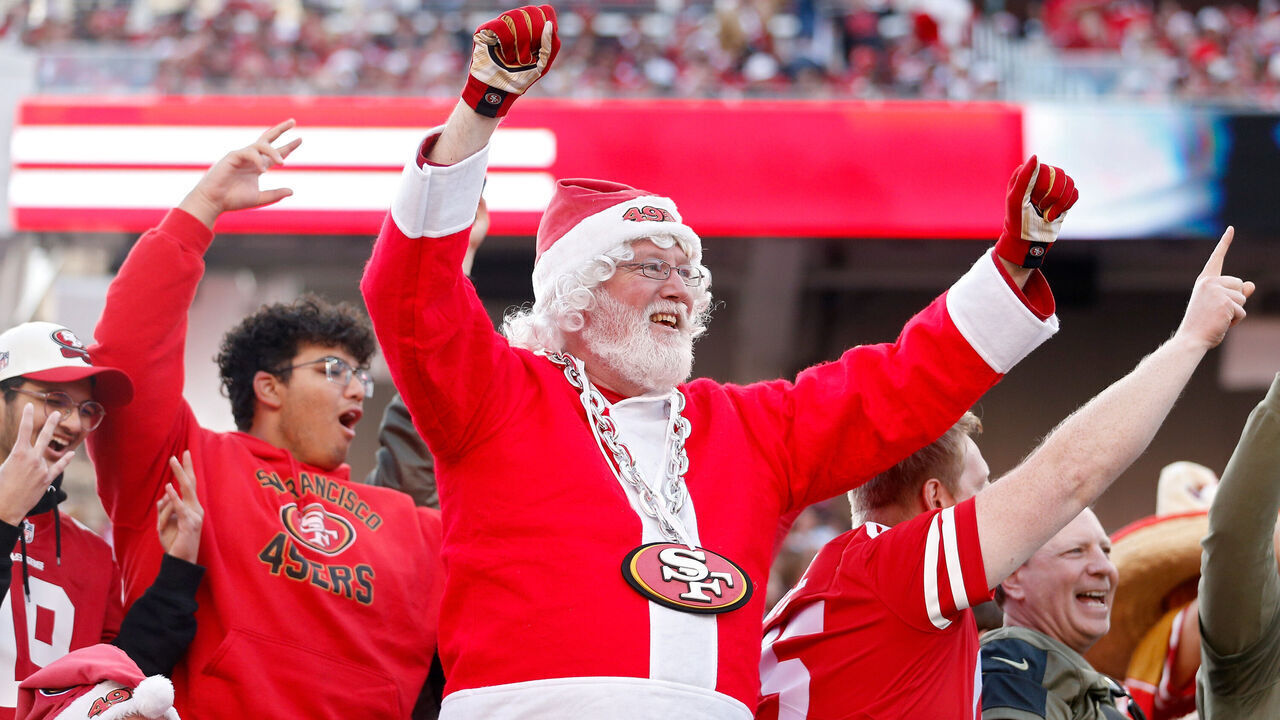 SANTA CLARA, CALIFORNIA - DECEMBER 24: A fan dressed as Santa Claus in the stands during the second half of the game between the Washington Commanders and the San Francisco 49ers at Levi's Stadium on December 24, 2022 in Santa Clara, California.