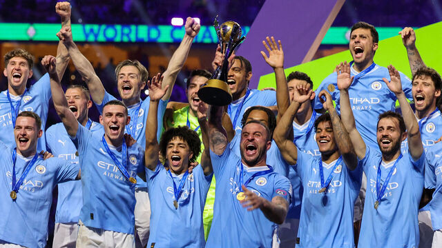 Manchester City players celebrate with their winning trophy at the end of the FIFA Club World Cup 2023 football final match against Brazil's Fluminense at King Abdullah Sports City Stadium in Jeddah on December 22, 2023.