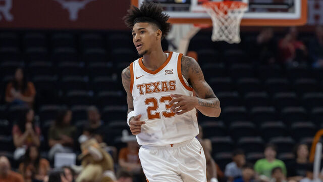 AUSTIN, TX - DECEMBER 09: Texas Longhorns forward Dillon Mitchell (23) runs back up court after making a basket during the college basketball game between Texas Longhorns and Houston Christian Huskies on December 9, 2023, at Moody Center in Austin, TX.