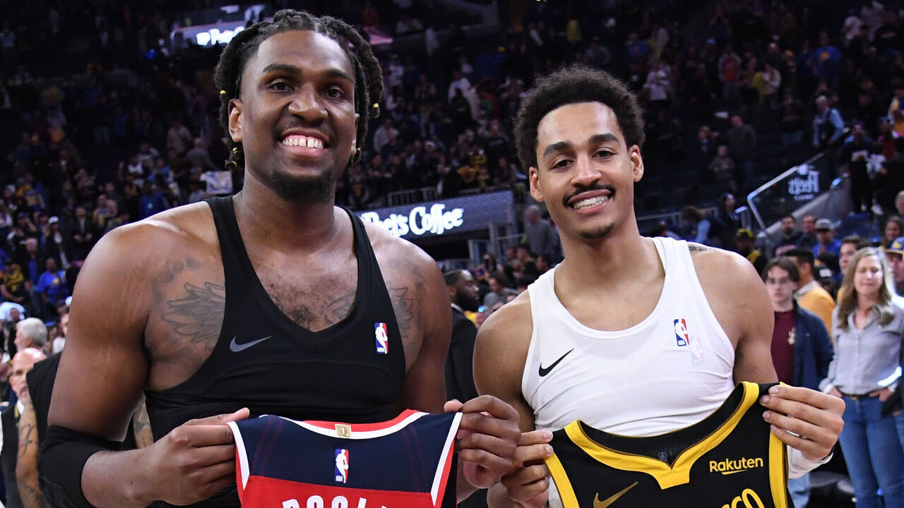 SAN FRANCISCO, CA - DECEMBER 22: Kevon Looney #5 of the Golden State Warriors and Jordan Poole #13 of the Washington Wizards swap jerseys after the game on December 22, 2023 at Chase Center in San Francisco, California. NOTE TO USER: User expressly acknowledges and agrees that, by downloading and or using this photograph, user is consenting to the terms and conditions of Getty Images License Agreement. Mandatory Copyright Notice: Copyright 2023 NBAE