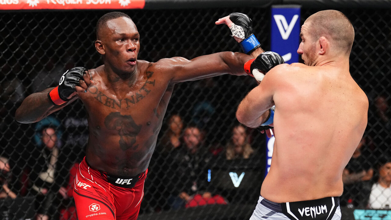 SYDNEY, AUSTRALIA - SEPTEMBER 10: (L-R) Israel Adesanya of Nigeria punches Sean Strickland in the UFC middleweight championship fight during the UFC 293 event at Qudos Bank Arena on September 10, 2023 in Sydney, Australia.