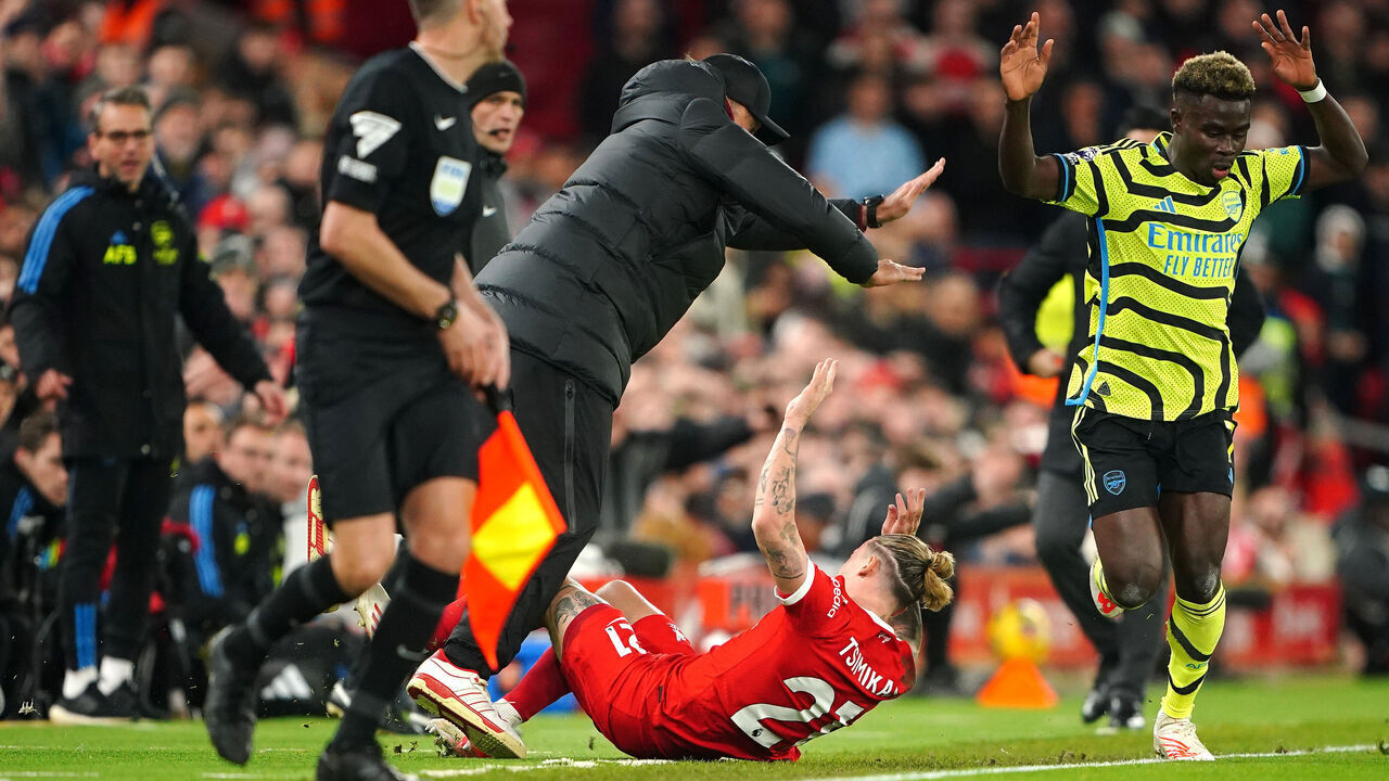 Liverpool's Kostas Tsimikas collids in to manager Jurgen Klopp during the Premier League match at Anfield, Liverpool. Picture date: Saturday December 23, 2023.