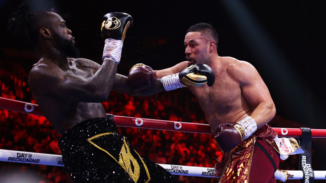 RIYADH, SAUDI ARABIA - DECEMBER 23: Joseph Parker punches Deontay Wilder during the WBC International & WBO Intercontinental Heavyweight title fight between Deontay Wilder and Joseph Parker during the Day of Reckoning: Fight Night at Kingdom Arena on December 23, 2023 in Riyadh, Saudi Arabia.