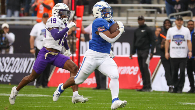 FORT WORTH, TX - DECEMBER 23: Air Force Falcons fullback Emmanuel Michel (4) runs for a first down during the Lockheed Martin Armed Forces Bowl between the James Madison Dukes and the Air Force Falcons on December 23, 2023 at Amon G. Carter Stadium in Fort Worth, TX.
