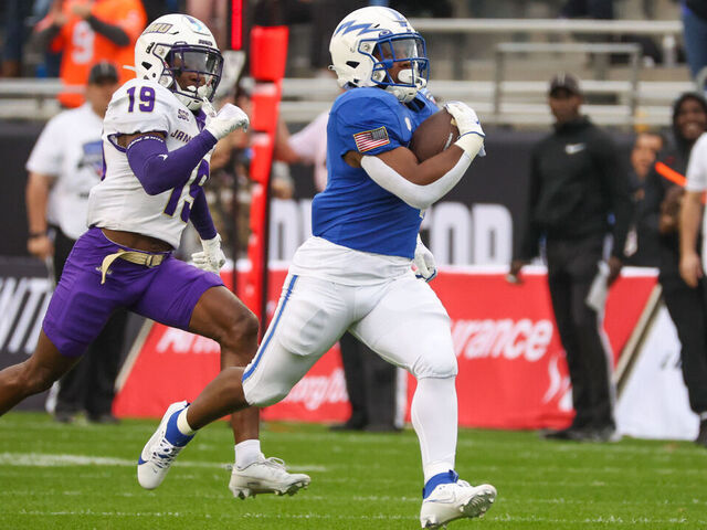 FORT WORTH, TX - DECEMBER 23: Air Force Falcons fullback Emmanuel Michel (4) runs for a first down during the Lockheed Martin Armed Forces Bowl between the James Madison Dukes and the Air Force Falcons on December 23, 2023 at Amon G. Carter Stadium in Fort Worth, TX.