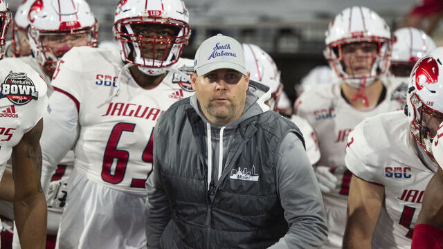 MOBILE, ALABAMA - DECEMBER 23: Head coach Kane Wommack of the South Alabama Jaguars leads his team on to the field prior to their game against the Eastern Michigan Eagles in the 68 Ventures Bowl at Hancock Whitney Stadium on December 23, 2023 in Mobile, Alabama.