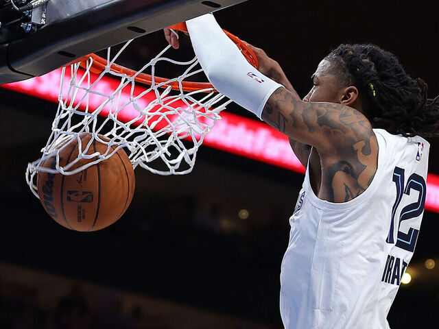 ATLANTA, GEORGIA - DECEMBER 23: Ja Morant #12 of the Memphis Grizzlies dunks against the Atlanta Hawks during the third quarter at State Farm Arena on December 23, 2023 in Atlanta, Georgia. NOTE TO USER: User expressly acknowledges and agrees that, by downloading and/or using this photograph, user is consenting to the terms and conditions of the Getty Images License Agreement.
