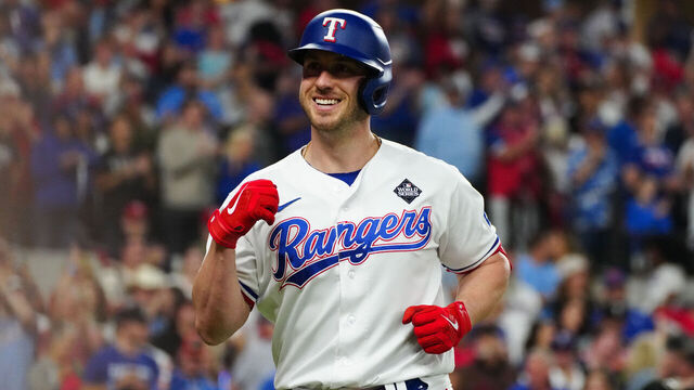 ARLINGTON, TX - OCTOBER 28: Mitch Garver #18 of the Texas Rangers smiles after hitting a solo home run in the fifth inning during Game 2 of the 2023 World Series between the Arizona Diamondbacks and the Texas Rangers at Globe Life Field on Saturday, October 28, 2023 in Arlington, Texas.