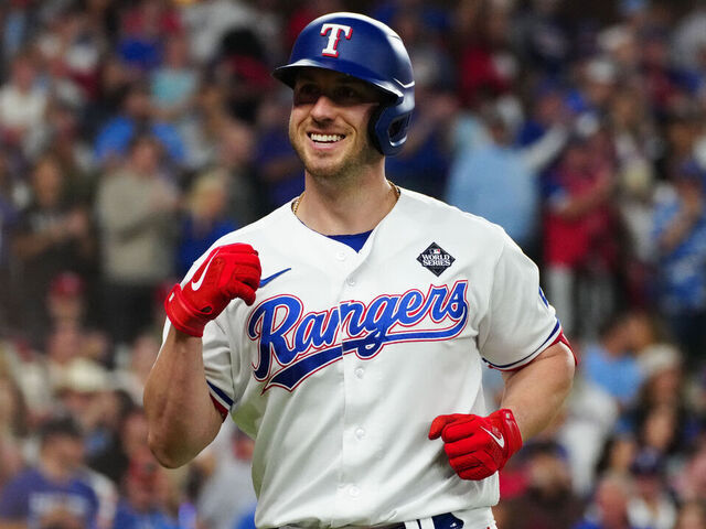 ARLINGTON, TX - OCTOBER 28: Mitch Garver #18 of the Texas Rangers smiles after hitting a solo home run in the fifth inning during Game 2 of the 2023 World Series between the Arizona Diamondbacks and the Texas Rangers at Globe Life Field on Saturday, October 28, 2023 in Arlington, Texas.
