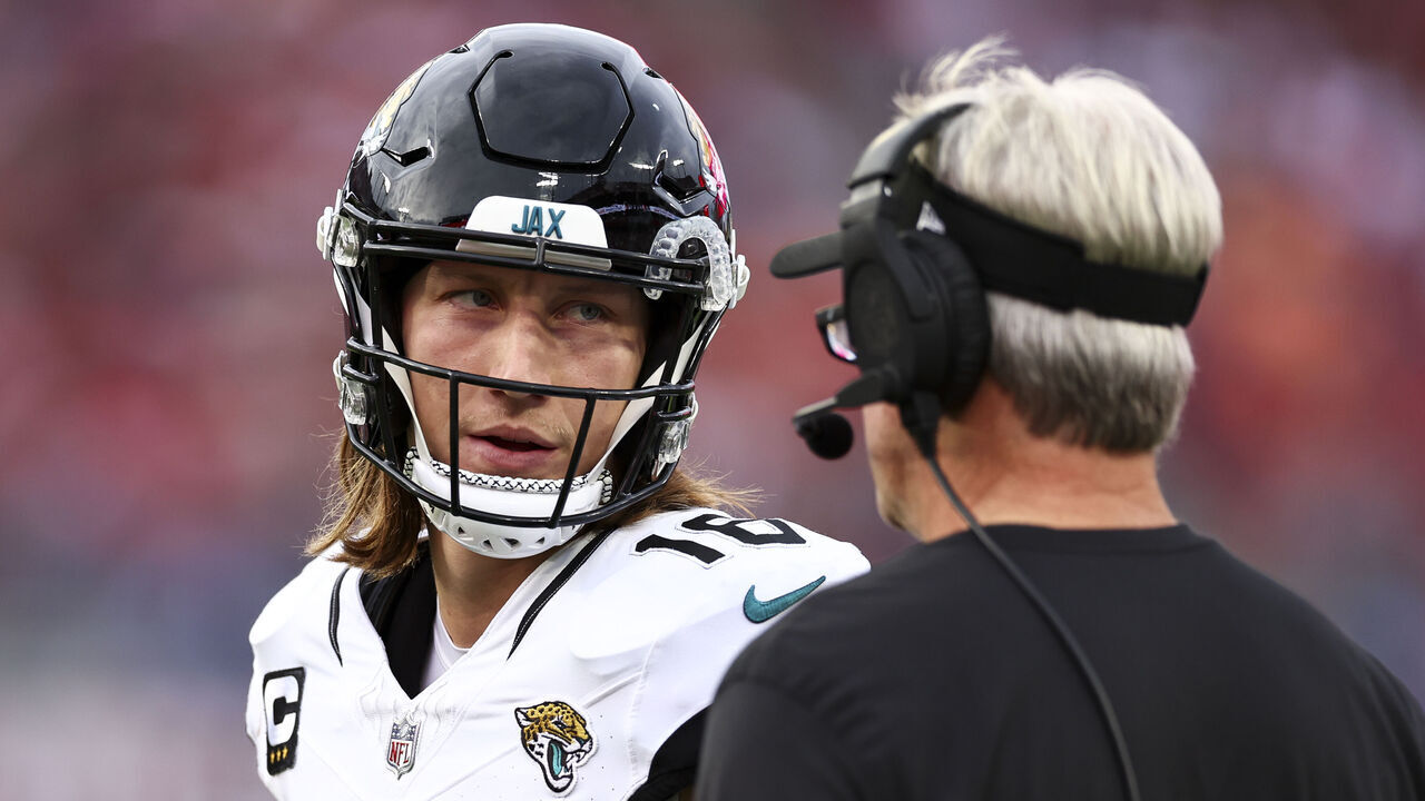 TAMPA, FL - DECEMBER 24: Trevor Lawrence #16 of the Jacksonville Jaguars talks with head coach Doug Pederson during the second quarter of an NFL football game against the Tampa Bay Buccaneers at Raymond James Stadium on December 24, 2023 in Tampa, Florida.