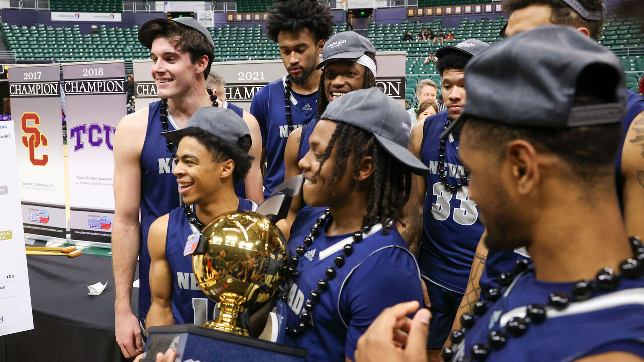 HONOLULU, HAWAII - DECEMBER 24: Tyler Rolison #3 of the Nevada Wolf Pack holds the championship trophy after winning the championship game of the Diamond Head Classic against the Georgia Tech Yellow Jackets at SimpliFi Arena on December 24, 2023 in Honolulu, Hawaii.