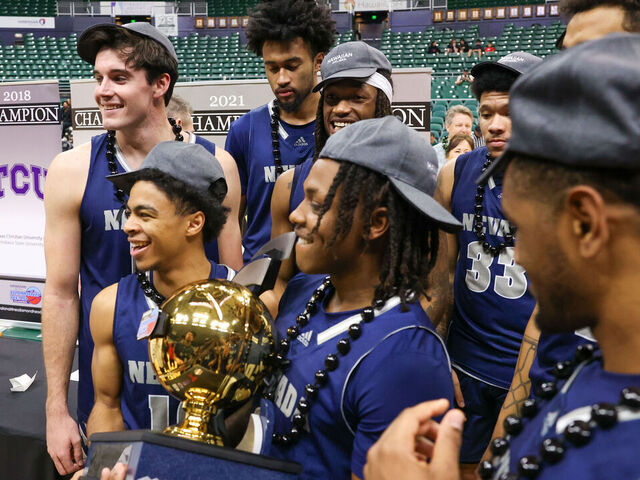 HONOLULU, HAWAII - DECEMBER 24: Tyler Rolison #3 of the Nevada Wolf Pack holds the championship trophy after winning the championship game of the Diamond Head Classic against the Georgia Tech Yellow Jackets at SimpliFi Arena on December 24, 2023 in Honolulu, Hawaii.