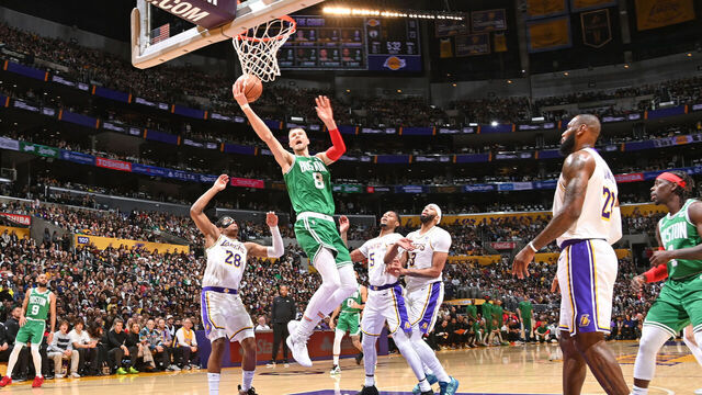 LOS ANGELES, CA - DECEMBER 25: Kristaps Porzingis #8 of the Boston Celtics drives to the basket during the game against the Los Angeles Lakers on December 25, 2023 at Crypto.Com Arena in Los Angeles, California. NOTE TO USER: User expressly acknowledges and agrees that, by downloading and/or using this Photograph, user is consenting to the terms and conditions of the Getty Images License Agreement. Mandatory Copyright Notice: Copyright 2023 NBAE