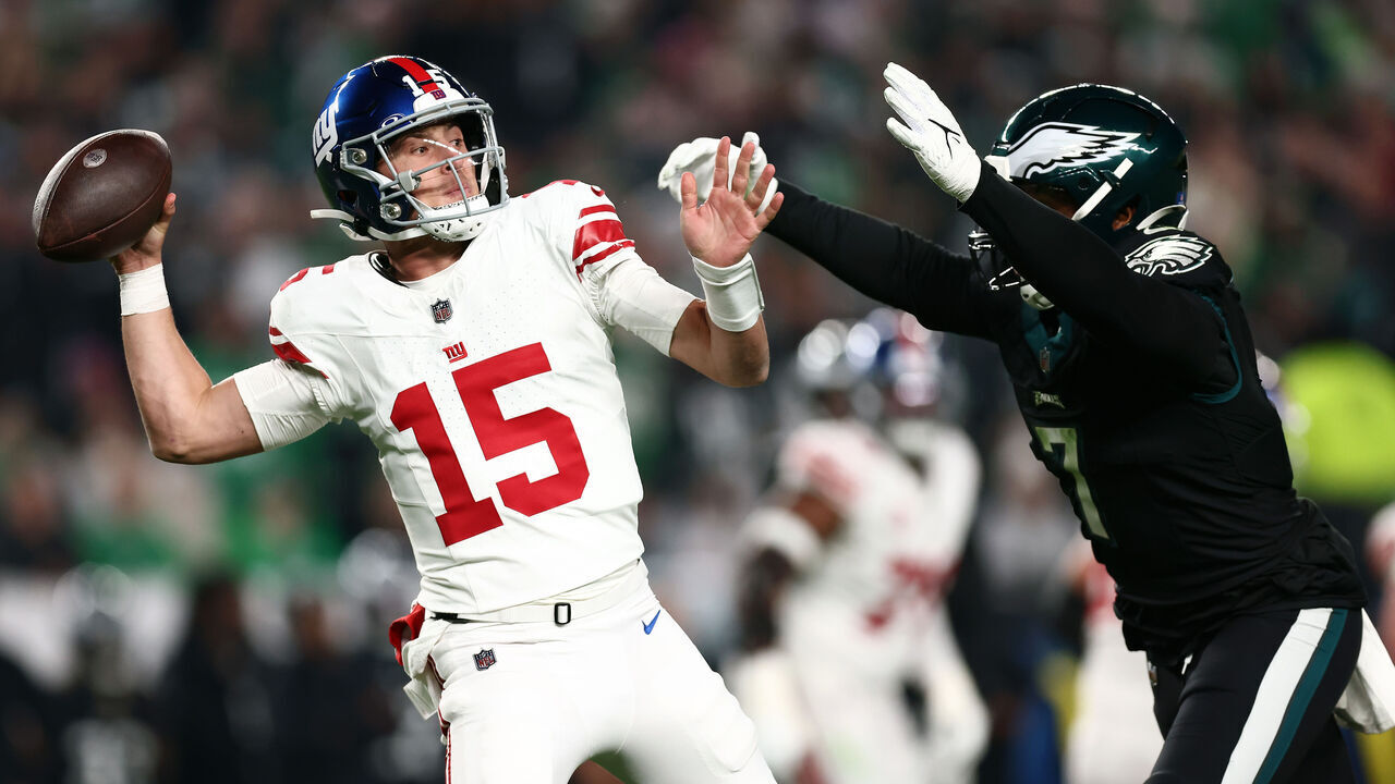 PHILADELPHIA, PENNSYLVANIA - DECEMBER 25: Tommy DeVito #15 of the New York Giants passes the ball against Haason Reddick #7 of the Philadelphia Eagles during the second quarter at Lincoln Financial Field on December 25, 2023 in Philadelphia, Pennsylvania.