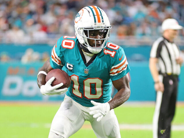 MIAMI GARDENS, FLORIDA - DECEMBER 24: Tyreek Hill #10 of the Miami Dolphins runs for yards during a game against the Dallas Cowboys at Hard Rock Stadium on December 24, 2023 in Miami Gardens, Florida. The Dolphins defeated the Cowboys 22-20.