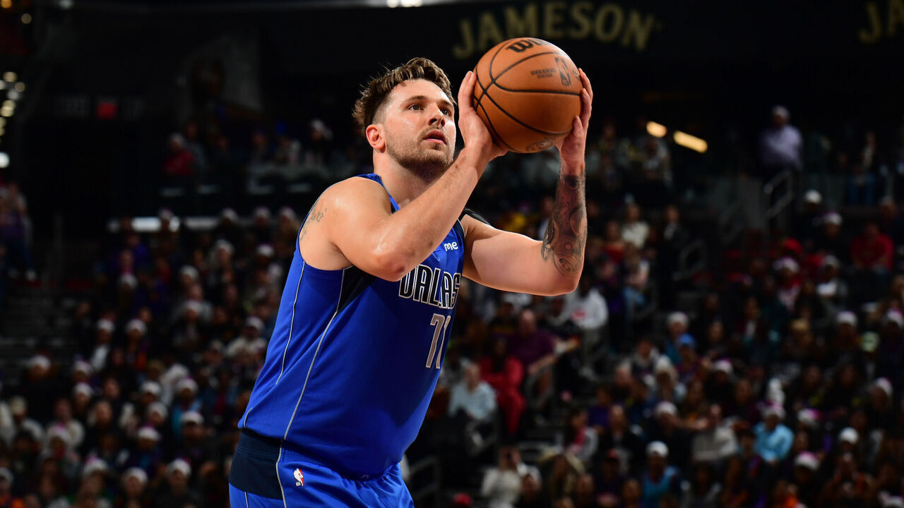 PHOENIX, AZ - DECEMBER 25: Luka Doncic #77 of the Dallas Mavericks shoots a free throw during the game against the Phoenix Suns on December 25, 2023 at Footprint Center in Phoenix, Arizona. Mandatory Copyright Notice: Copyright 2023 NBAE