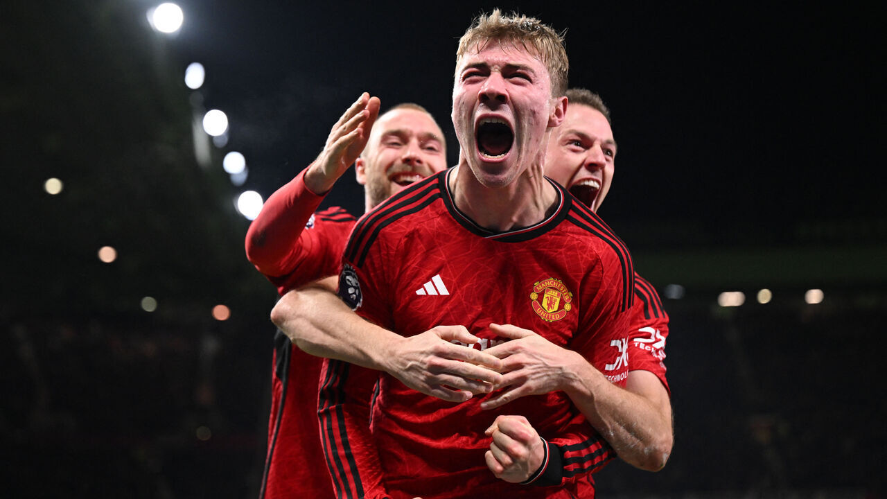 Manchester United's Danish striker #11 Rasmus Hojlund (C) celebrates with teammates after scoring their third goal during the English Premier League football match between Manchester United and Aston Villa at Old Trafford in Manchester, north west England, on December 26, 2023.