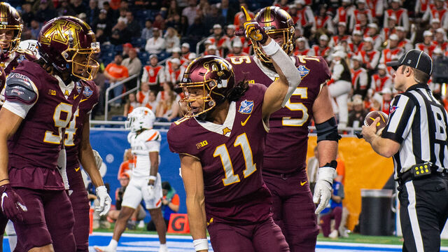 DETROIT, MICHIGAN - DECEMBER 26: Elijah Spencer #11 of the Minnesota Golden Gophers reacts after scoring a touchdown during the first half of the Quick Lane Bowl against the Bowling Green Falcons at Ford Field on December 26, 2023 in Detroit, Michigan.