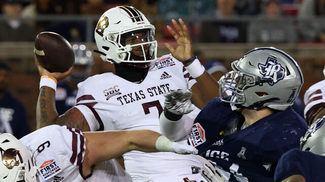 DALLAS, TEXAS - DECEMBER 26: Quarterback TJ Finley #7 of the Texas State Bobcats passes the ball in the first quarter against the Rice Owls at the SERVPRO First Responder Bowl at Gerald J. Ford Stadium on December 26, 2023 in Dallas, Texas.