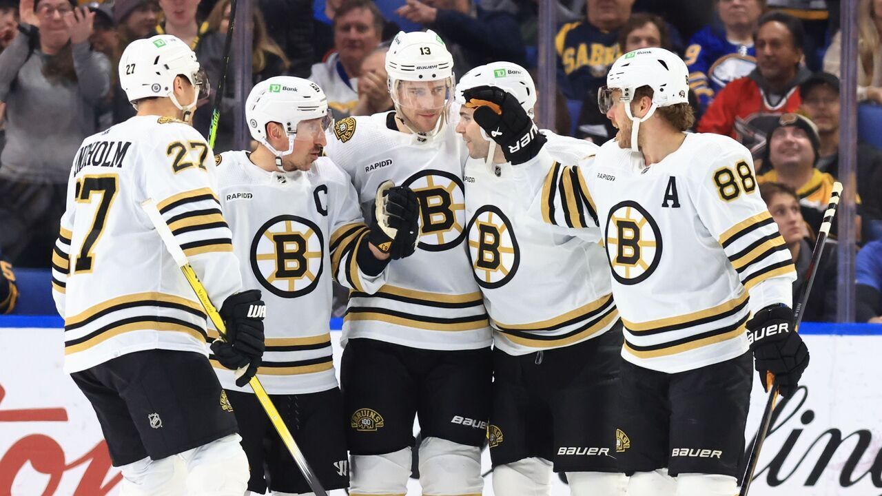 BUFFALO, NEW YORK - DECEMBER 27: Charlie Coyle #13 of the Boston Bruins celebrates his first period goal against the Buffalo Sabres with Hampus Lindholm #27, Brad Marchand #63, Jake DeBrusk #74 and David Pastrnak #88 during an NHL game on December 27, 2023 at KeyBank Center in Buffalo, New York.