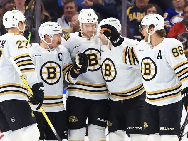 BUFFALO, NEW YORK - DECEMBER 27: Charlie Coyle #13 of the Boston Bruins celebrates his first period goal against the Buffalo Sabres with Hampus Lindholm #27, Brad Marchand #63, Jake DeBrusk #74 and David Pastrnak #88 during an NHL game on December 27, 2023 at KeyBank Center in Buffalo, New York.