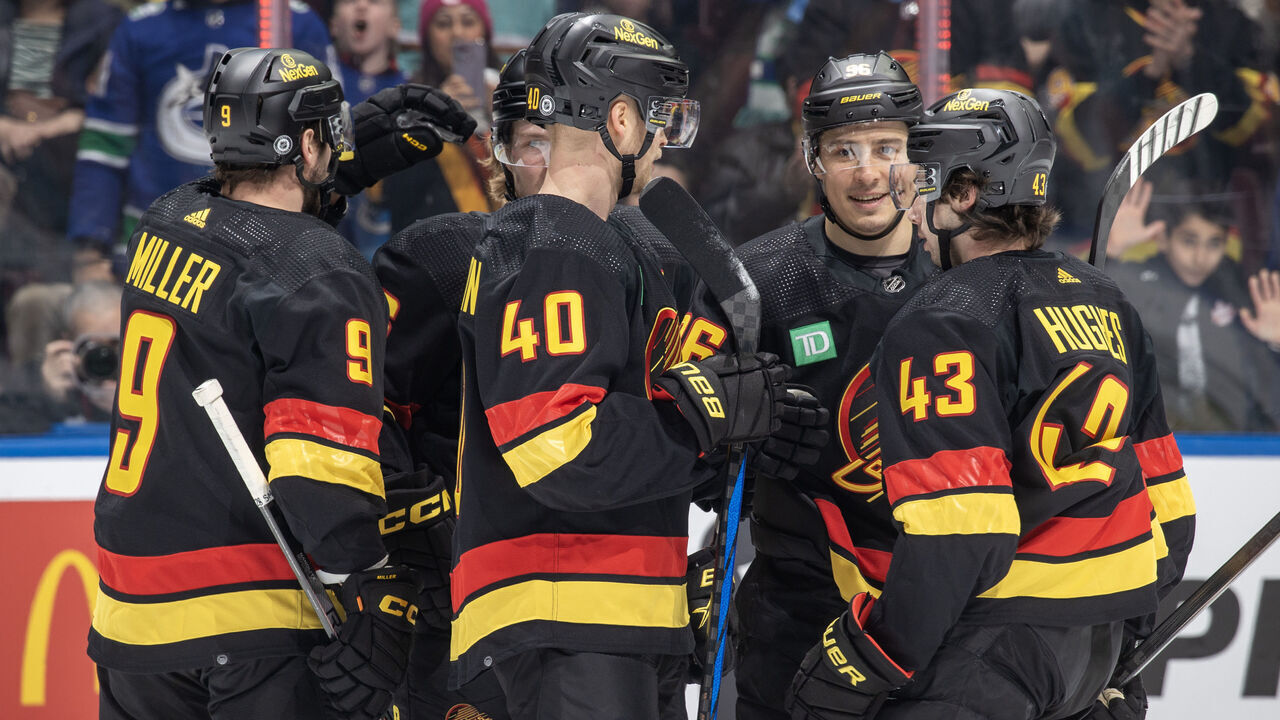 VANCOUVER, CANADA - DECEMBER 23: Andrei Kuzmenko #96 of the Vancouver Canucks celebrates his second goal with teammates during the first period of their NHL game against the San Jose Sharks at Rogers Arena on December 23, 2023 in Vancouver, British Columbia, Canada.