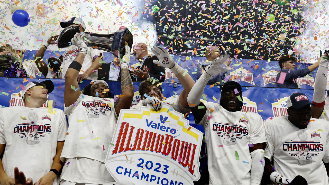 SAN ANTONIO, TX - DECEMBER 28: tHE Arizona Wildcats celebrate after defeating Oklahoma Sooners at the Valero Alamo Bowl at the Alamodome on December 28, 2023 in San Antonio, Texas.