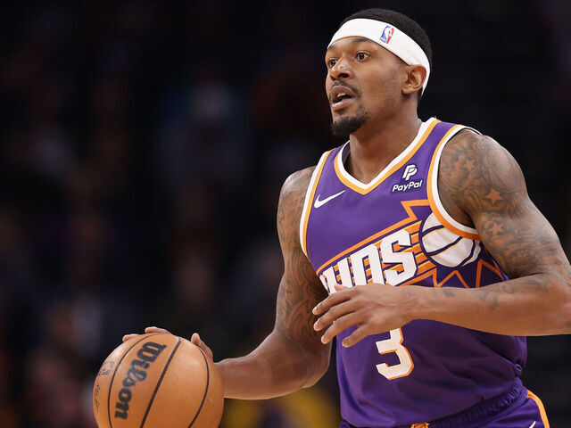 PHOENIX, ARIZONA - DECEMBER 12: Bradley Beal #3 of the Phoenix Suns handles the ball during the first half of the NBA game against the Golden State Warriors at Footprint Center on December 12, 2023 in Phoenix, Arizona.