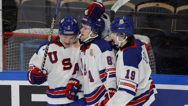USA's forward Jimmy Snuggerud (C) celebrates scoring the 0-3 goal with USA's forward Cutter Gauthier (R) and USA's forward Rutger McGroarty (L) during the Group B ice hockey match between Switzerland and USA of the IIHF World Junior Championship in Gothenburg, Sweden, on December 28, 2023.