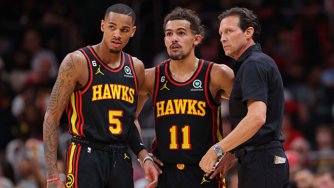 ATLANTA, GEORGIA - APRIL 21: Head coach Quin Snyder of the Atlanta Hawks converses with Trae Young #11 and Dejounte Murray #5 against the Boston Celtics during the fourth quarter of Game Three of the Eastern Conference First Round Playoffs at State Farm Arena on April 21, 2023 in Atlanta, Georgia.