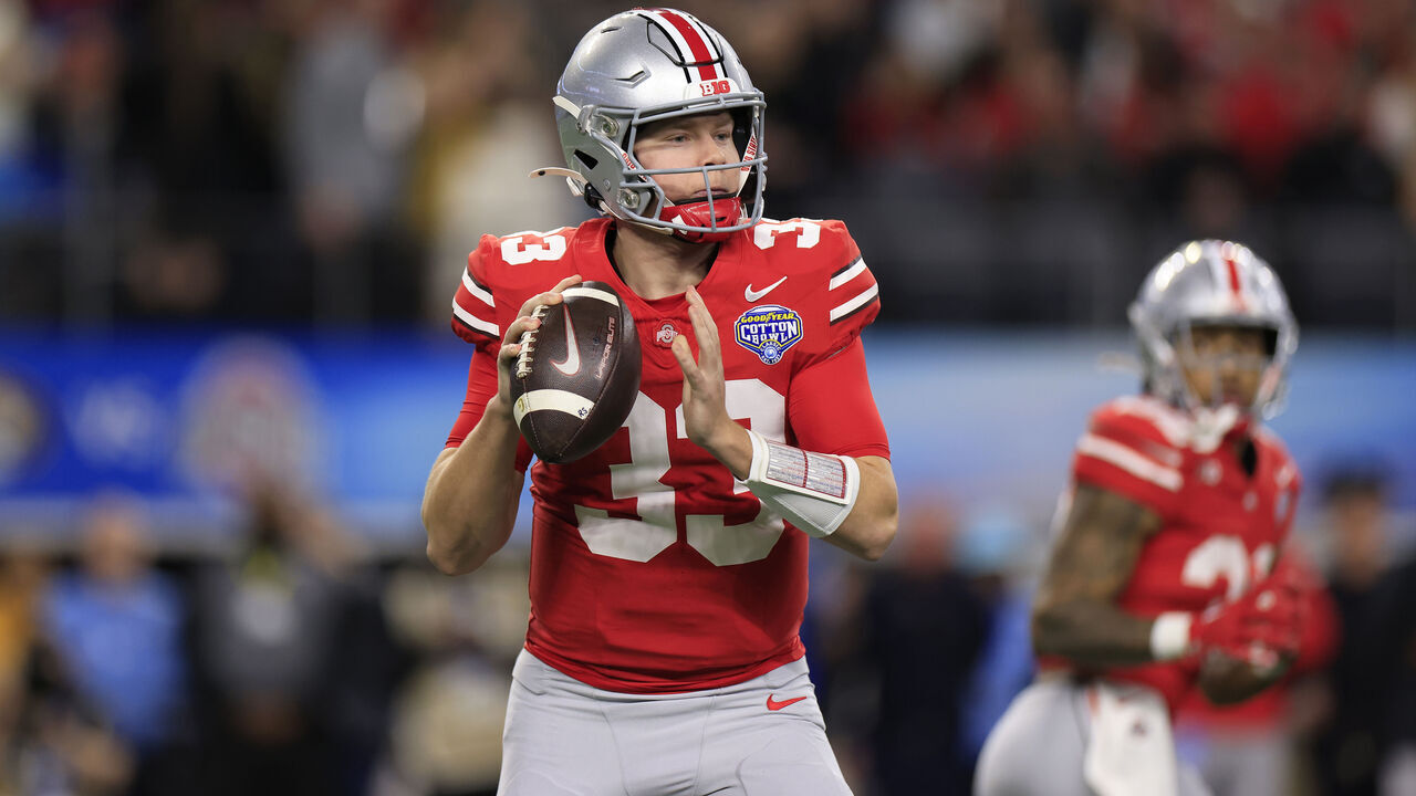 ARLINGTON, TEXAS - DECEMBER 29: Devin Brown #33 of the Ohio State Buckeyes looks to throw the ball during the first quarter against the Missouri Tigers during the Goodyear Cotton Bowl at AT&T Stadium on December 29, 2023 in Arlington, Texas.