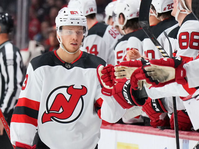 OTTAWA, CANADA - DECEMBER 29: Jesper Bratt #63 of the New Jersey Devils celebrates his first-period goal against the Ottawa Senators with teammates at the players' bench at Canadian Tire Centre on December 29, 2023 in Ottawa, Ontario, Canada.