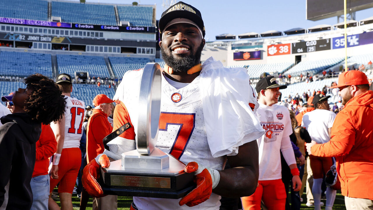 JACKSONVILLE, FL - DECEMBER 29: Running back Phil Mafah #7 of the Clemson Tigers poses with his MVP trophy after the game against the Kentucky Wildcats at the 79th annual TaxSlayer Gator Bowl at EverBank Stadium on December 29, 2023 in Jacksonville, Florida. The Tigers defeated the Wildcats 38 to 35.
