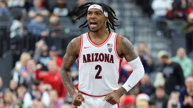 LAS VEGAS, NEVADA - DECEMBER 23: Caleb Love #2 of the Arizona Wildcats reacts after scoring a basket against the Florida Atlantic Owls in the second half of the Desert Classic at T-Mobile Arena on December 23, 2023 in Las Vegas, Nevada. The Owls defeated the Wildcats 96-95 in double overtime.