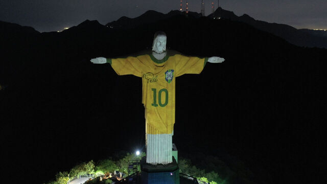 An image projected onto the Christ the Redeemer statue pays tribute to Brazilian football legend Pele on the first anniversary of his death, at Corcovado Mount in Rio de Janeiro, Brazil, on December 29, 2023.