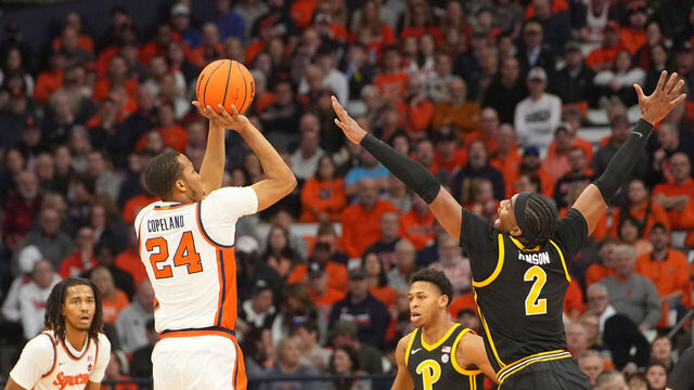 SYRACUSE, NY - DECEMBER 30: Syracuse Orange Guard Quadir Copeland (24) shoots a three point jump shot against Pittsburgh Panthers Forward Blake Hinson (2) during the first half of the College Basketball game between the Pittsburgh Panthers and the Syracuse Orange on December 30, 2023, at the JMA Wireless Dome in Syracuse, NY.