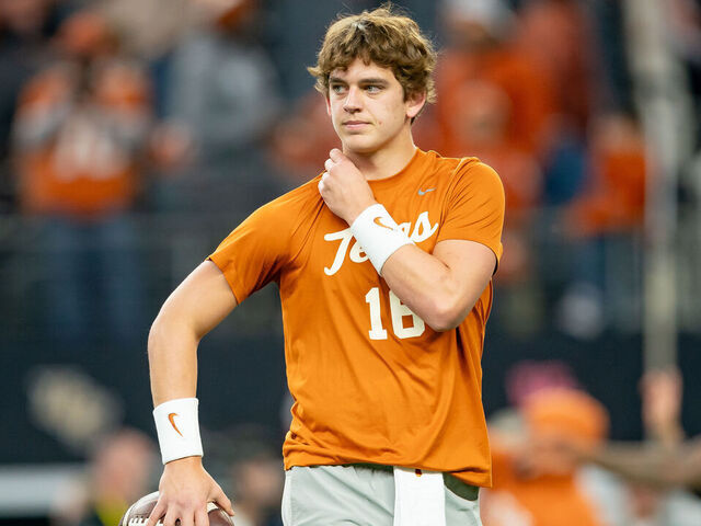 ARLINGTON, TX - DECEMBER 02:Texas Longhorns quarterback Arch Manning (16) gets loose before the Big 12 Championship game between the Texas Longhorns and the Oklahoma State Cowboys on December 02, 2023 at AT&T Stadium in Arlington, TX.