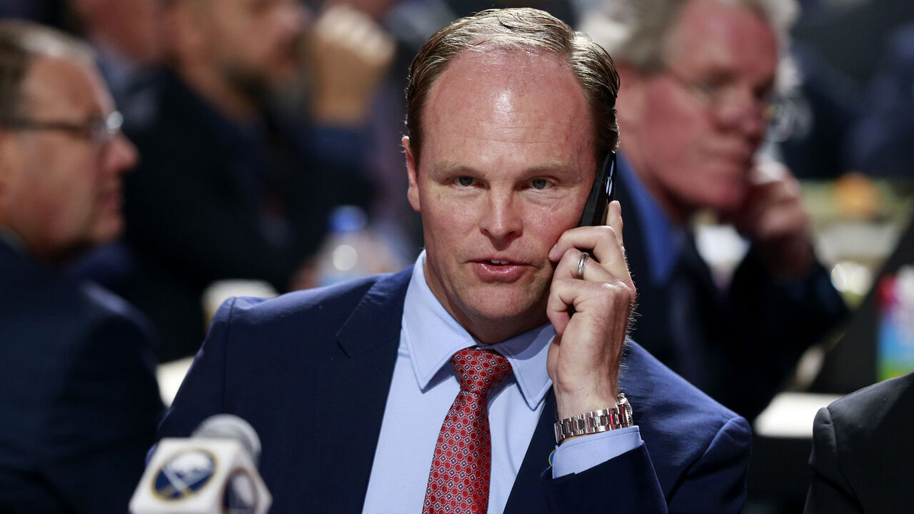 MONTREAL, QUEBEC - JULY 07: Kevyn Adams of the Buffalo Sabres talks on the phone during the first round of the 2022 Upper Deck NHL Draft at Bell Centre on July 07, 2022 in Montreal, Quebec.