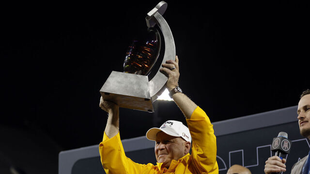 TUCSON, ARIZONA - DECEMBER 30: Head coach Craig Bohl of the Wyoming Cowboys holds the championship trophy after the Cowboys defeated the Toledo Rockets 16-15 during the Barstool Sports Arizona Bowl at Arizona Stadium on December 30, 2023 in Tucson, Arizona.