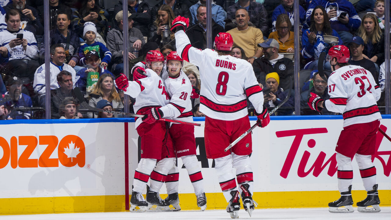 TORONTO, ON - DECEMBER 30: Michael Bunting #58 of the Carolina Hurricanes celebrates his goal against the Toronto Maple Leafs with teammates Sebastian Aho #20, Brent Burns #8 and Andrei Svechnikov #37 during the first period at the Scotiabank Arena on December 30, 2023 in Toronto, Ontario, Canada.