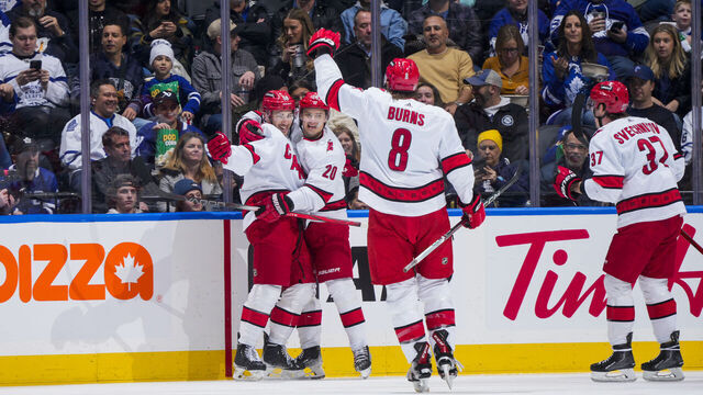 TORONTO, ON - DECEMBER 30: Michael Bunting #58 of the Carolina Hurricanes celebrates his goal against the Toronto Maple Leafs with teammates Sebastian Aho #20, Brent Burns #8 and Andrei Svechnikov #37 during the first period at the Scotiabank Arena on December 30, 2023 in Toronto, Ontario, Canada.