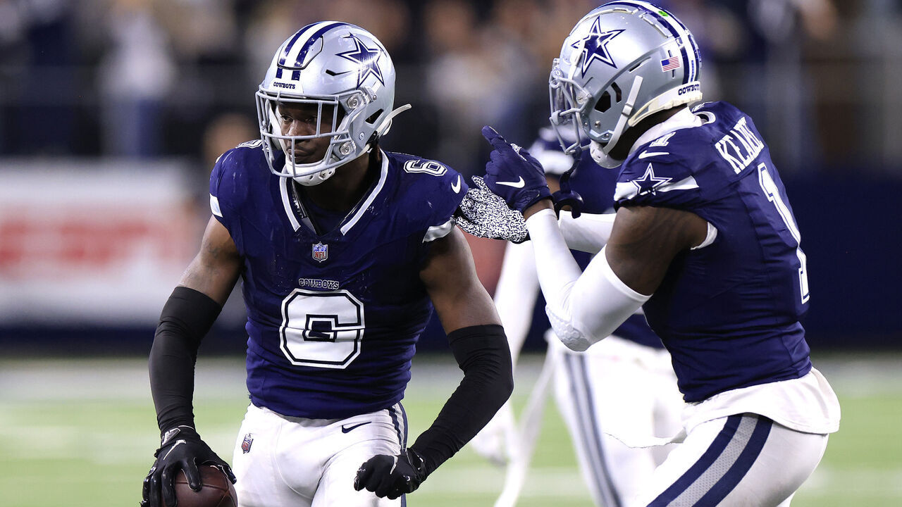 ARLINGTON, TEXAS - DECEMBER 30: Donovan Wilson #6 of the Dallas Cowboys celebrates with Jayron Kearse #1 after intercepting a pass thrown by Jared Goff #16 of the Detroit Lions during the fourth quarter in the game at AT&T Stadium on December 30, 2023 in Arlington, Texas.