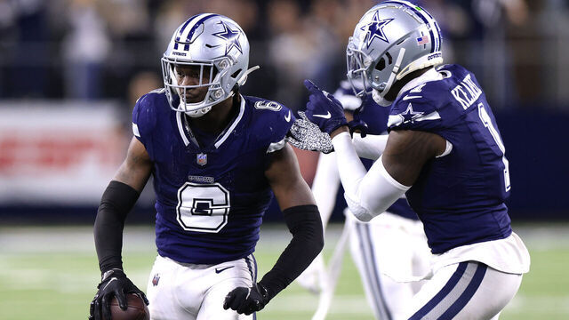 ARLINGTON, TEXAS - DECEMBER 30: Donovan Wilson #6 of the Dallas Cowboys celebrates with Jayron Kearse #1 after intercepting a pass thrown by Jared Goff #16 of the Detroit Lions during the fourth quarter in the game at AT&T Stadium on December 30, 2023 in Arlington, Texas.
