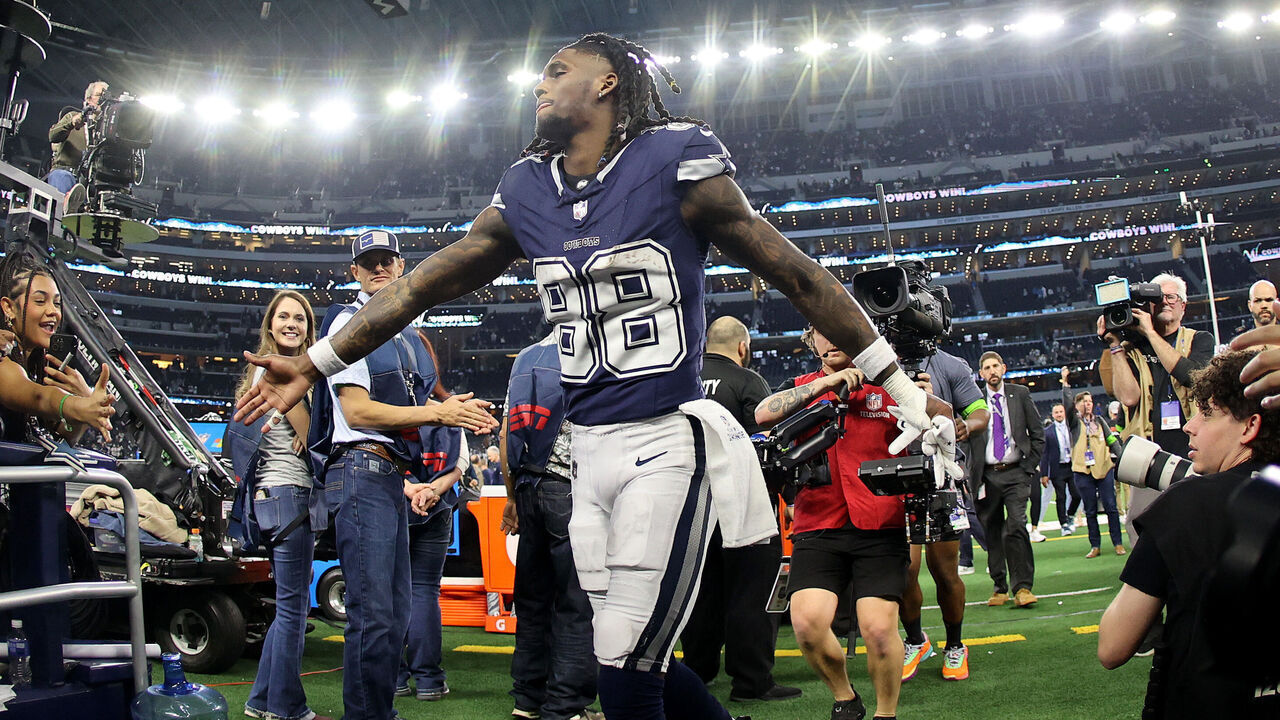 ARLINGTON, TEXAS - DECEMBER 30: CeeDee Lamb #88 of the Dallas Cowboys celebrates with fans after defeating the Detroit Lions in the game at AT&T Stadium on December 30, 2023 in Arlington, Texas.