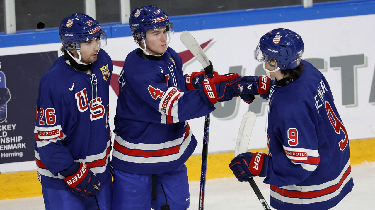 USA's Gavin Brindley (C) celebrates scoring the 2-0 goal with USA's defender Seamus Casey (L) and USA's forward Ryan Leonard during the Group B ice hockey match between USA and Norway of the IIHF World Junior Championship in Gothenburg, Sweden on December 26, 2023.