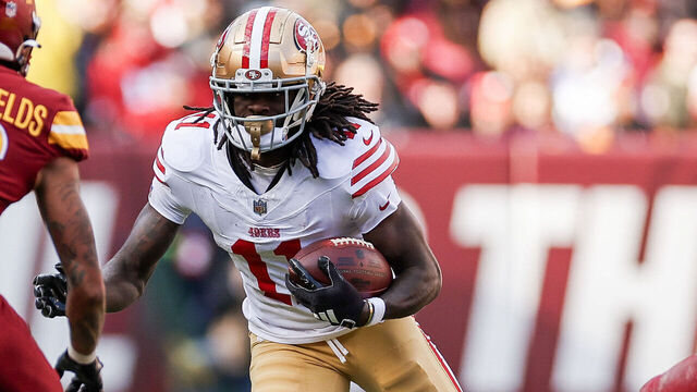 LANDOVER, MARYLAND - DECEMBER 31: Brandon Aiyuk #11 of the San Francisco 49ers runs with the ball after a first quarter catch on Commanders at FedExField on December 31, 2023 in Landover, Maryland.