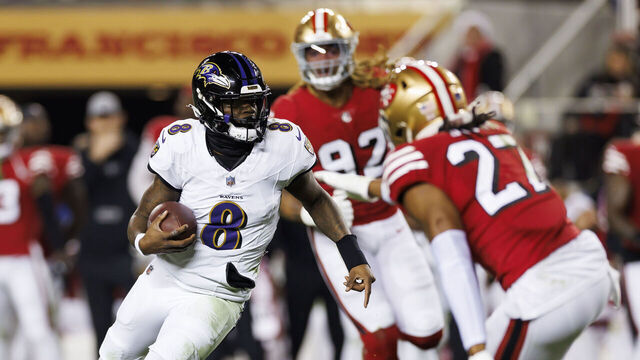 SANTA CLARA, CALIFORNIA - DECEMBER 25: Lamar Jackson #8 of the Baltimore Ravens runs the ball as he scrambles during an NFL football game against the San Francisco 49ers at Levi's Stadium on December 25, 2023 in Santa Clara, California.