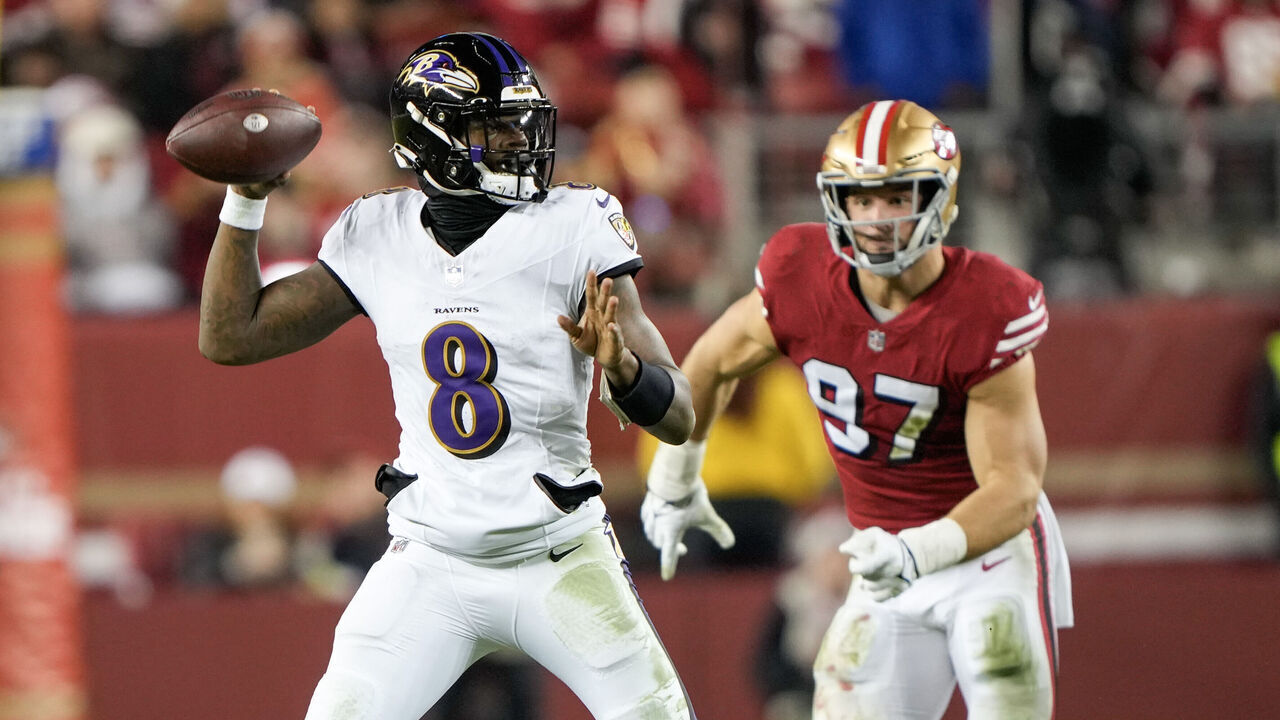 SANTA CLARA, CALIFORNIA - DECEMBER 25: Lamar Jackson #8 of the Baltimore Ravens attempts a pass during the third quarter against the San Francisco 49ers at Levi's Stadium on December 25, 2023 in Santa Clara, California.